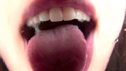 Tongue fetish porn pics of a Japanese girl licking the camera screen